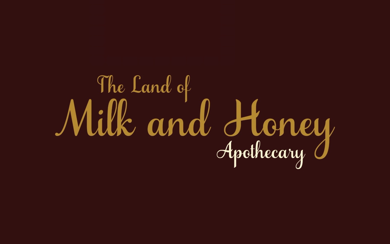 The Land of Milk and Honey Apothecary logo, gold script on maroon