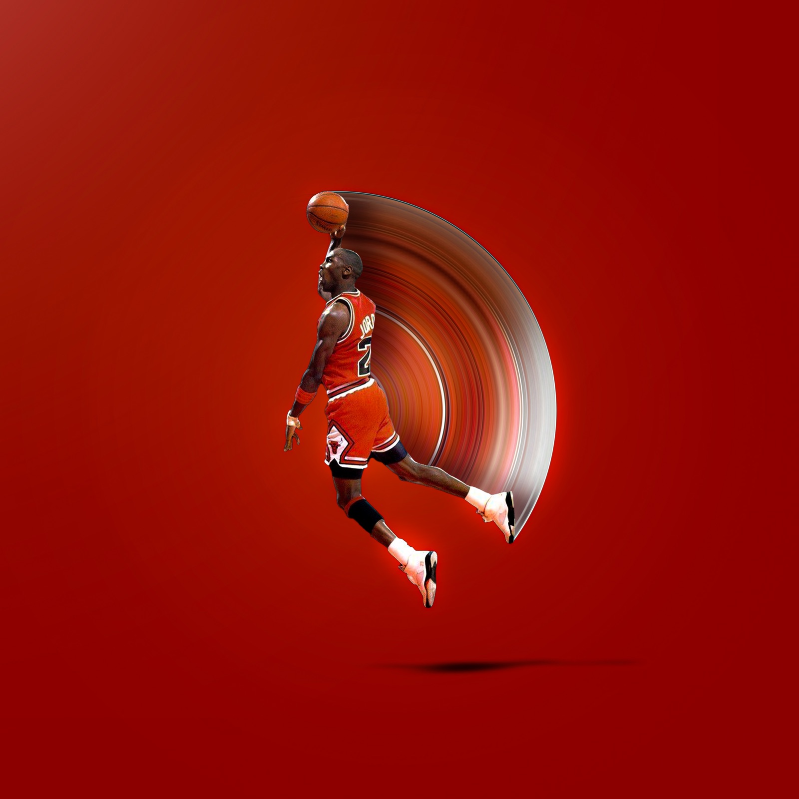 Michael Jordan mid-dunk on a red field, a motion arc trailing behind him