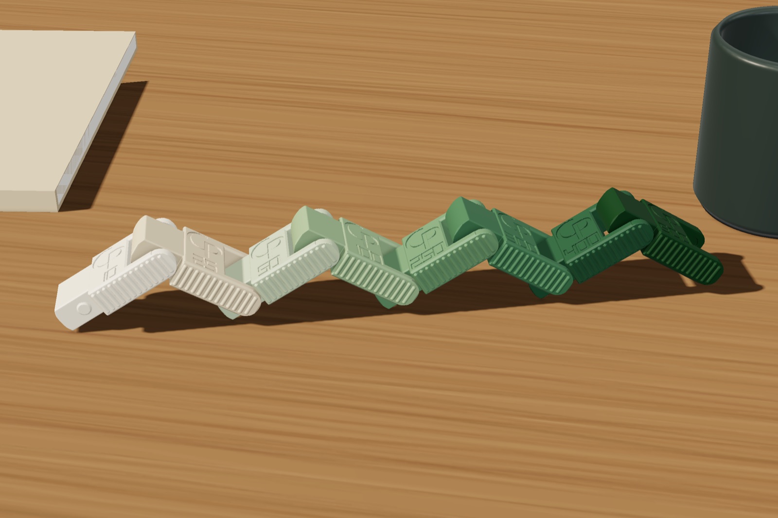 Render: the chain lying in a zigzag on a wooden desk between a notebook and a cup