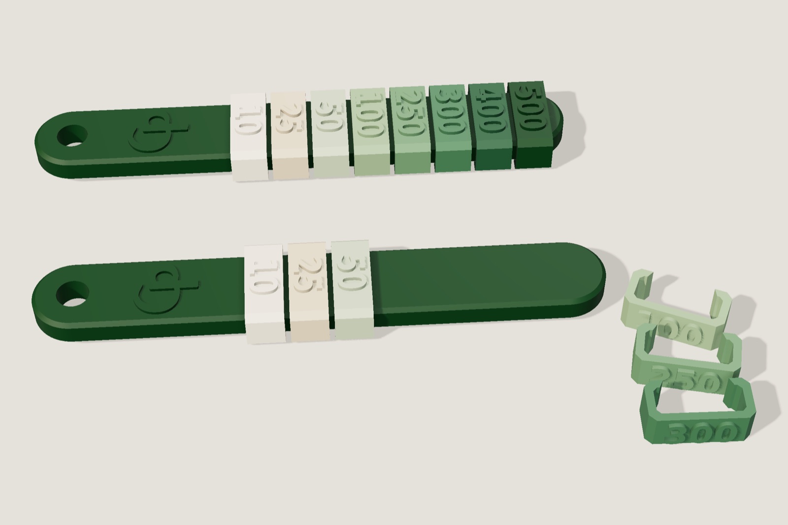 Render: two dark green bars with the CP mark; one carries eight numbered collars from 10 to 500, the other three, with more collars loose beside it